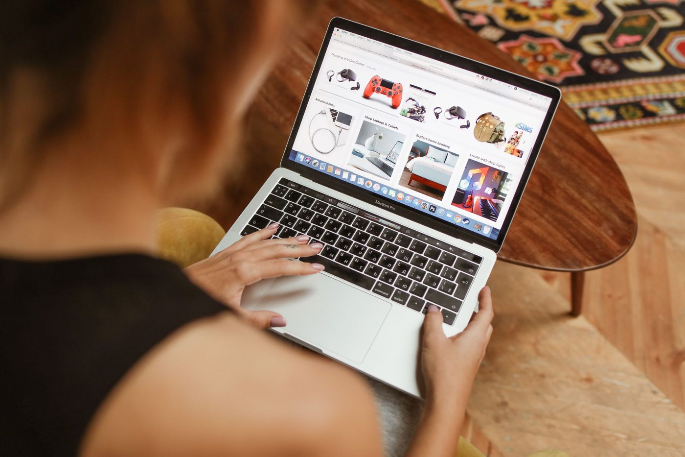 A person browses an online shop on a laptop.