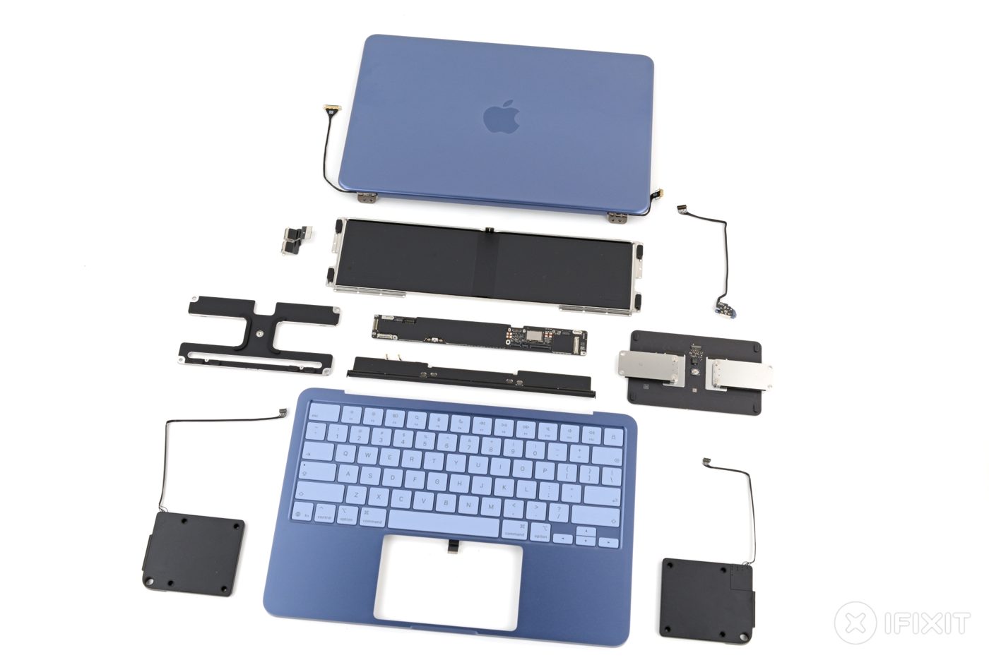 The MacBook Neo’s separated parts, photographed by iFixit.